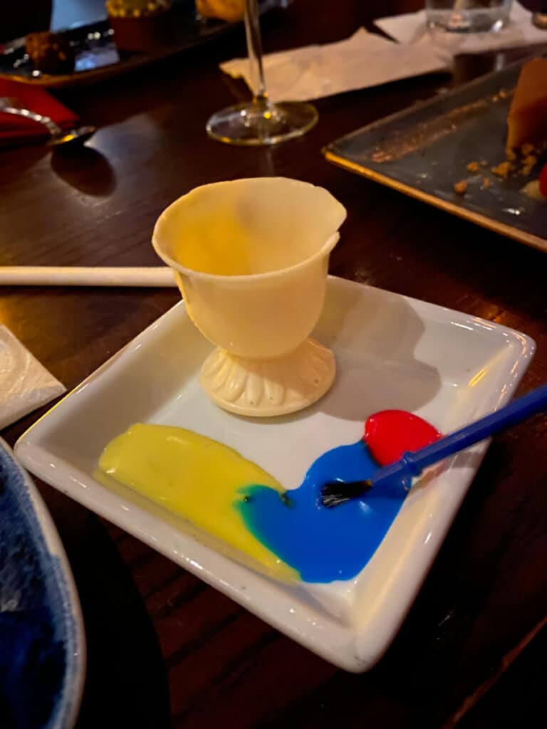 The white chocolate Chip dessert from Be Our Guest restaurant in the magic kingdom, which comes with colored icing and paint brushes that children can use to paint! 