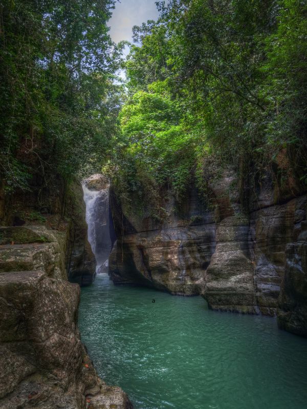 Cunca Wulang Waterfall with blue water, how it looks during the dry season from May - October
