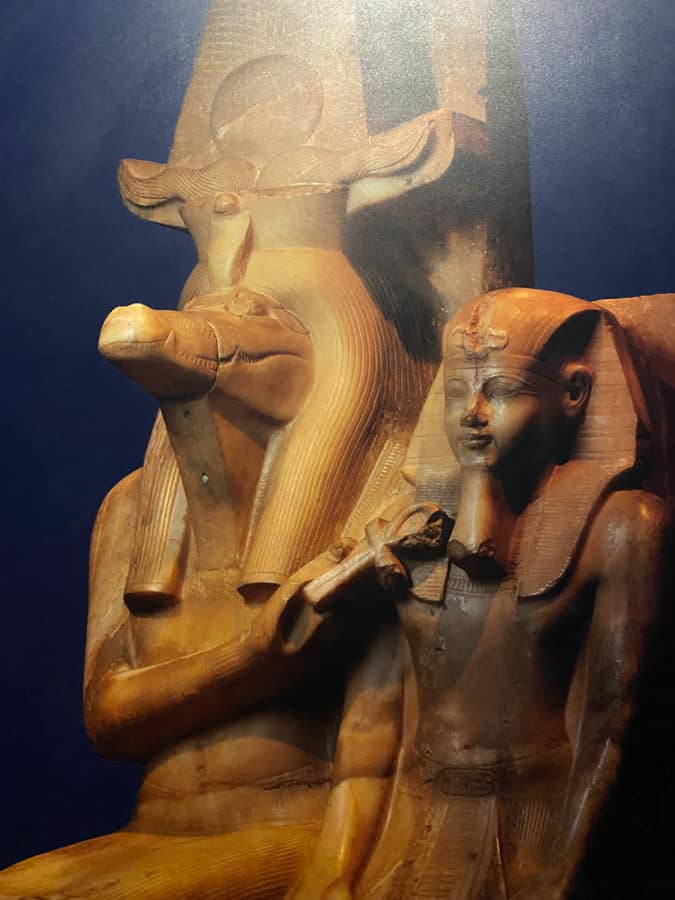 the ancient egyptian god Horus next to a figure of a crocodile at Kom Ombo crocodile museum in Egypt. Kom Ombo Crocodile Museum is just one of many amazing sights you can see while taking a Nile Cruise from Cairo to Luxor and Aswan.