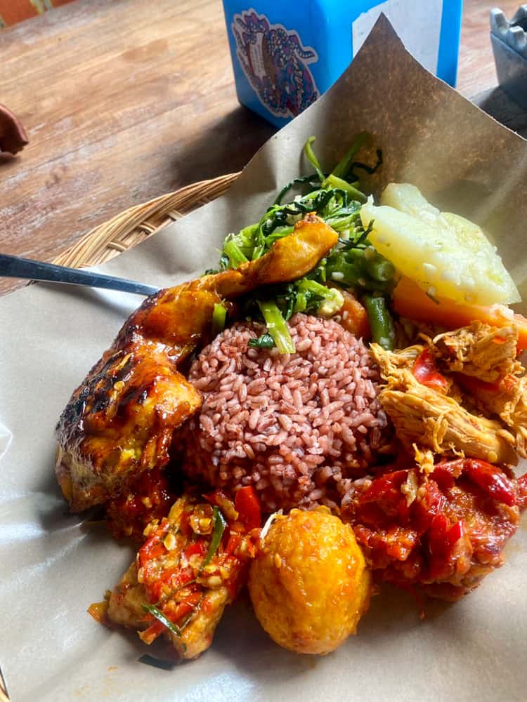 A Nasi Campur, which is a traditional Indonesian mixed plate you'll find at local warungs. 