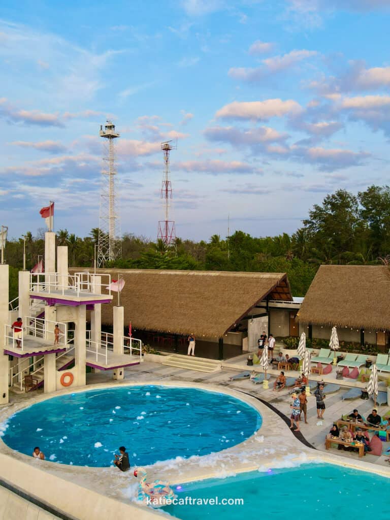 A beach club in Gili T with a high dive jumping platform into a circular pool.