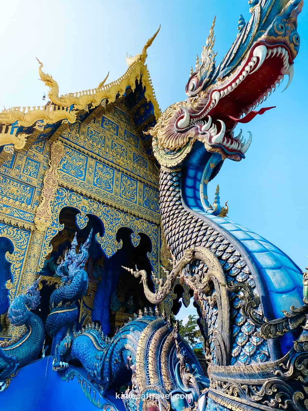 An intricately painted dragon sculpture outside of the Blue Temple in Chiang Rai, Thailand.