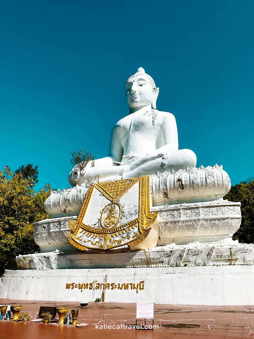 The big white buddha in Pai, Thailand. Photographed with a blue sky behind it.